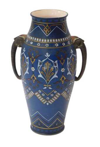 A late 19thC Mettlach pottery twin-handled vase, of cylindrical tapering form with incised...