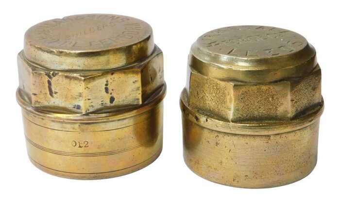 Two brass wagon caps, for Kirkstall Forge Company Leeds, and Chapmans and Sons Builders...