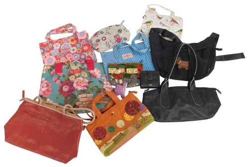 A group of handbags, to include two Radley leather bags, one in black and the other in two tone...