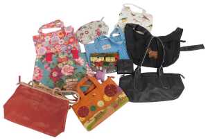 A group of handbags, to include two Radley leather bags, one in black and the other in two tone...