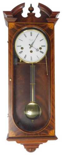 A Comitti of London mahogany cased Sheraton Revival wall clock, the circular white enamel dial...