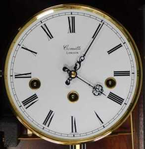 A Comitti of London mahogany cased Sheraton Revival wall clock, the circular white enamel dial... - 2