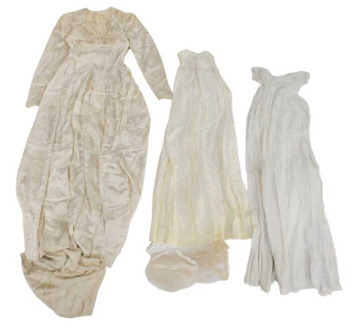 Textiles, comprising a broderie anglaise cotton Christening gown, a cream silk Christening gown,...