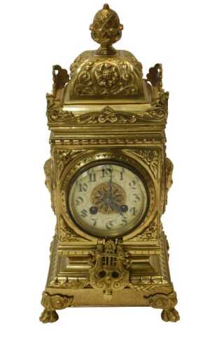 An early 20thC brass cased Renaissance Revival style mantel clock, with pineapple knopped finial,...