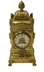 An early 20thC brass cased Renaissance Revival style mantel clock, with pineapple knopped finial,...