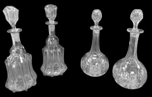 A pair of Georgian lead crystal mallet-shaped decanters and stoppers, 34cm high, together with...