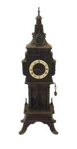 A Continental architectural style mantel clock, in the form of a clock tower, in a bronze...