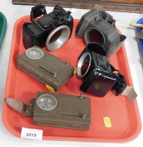 Three carbide lamps, including a Lucas Werna rear bicycle lamp, and two military battery torches....