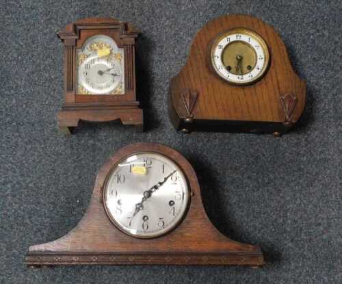 Three mantel clocks, all with Arabic numerals to dials.
