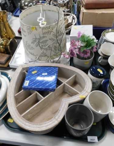 Decorative household items, including a heart-shaped wall hanging shelf, planters, a lamp shade,...