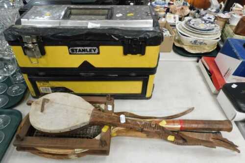 A large Stanley toolbox, two vintage tennis racquets, and a handmade musical instrument. (all...