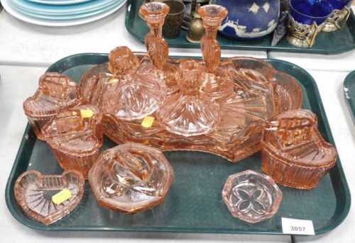 Glassware, decorative peach coloured glassware, including a dressing set with candle holders,...