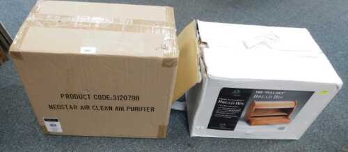 A boxed wooden bread bin, and a boxed NeoStar air clean air purifier.