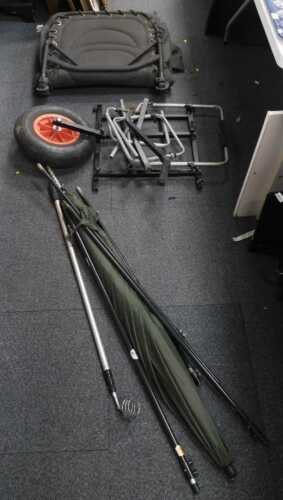 Fishing equipment, including bank poles, fishing seats. (1 bag, under 1 table)