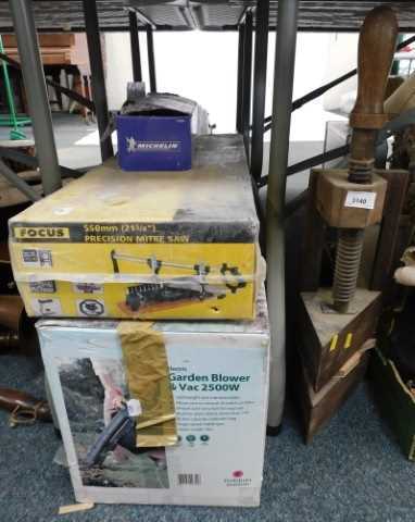 Tools, to include a large wood press, a Michelin single barrel footpump, a precision mitre saw,...