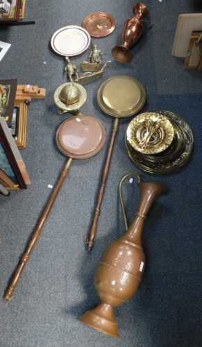 Copperware and brassware, to include large vases, water jugs, bed pans, chargers, figures, etc....