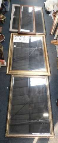 Mirrors, comprising a large gilt framed bevelled mirror, rectangular, smaller gilt framed...