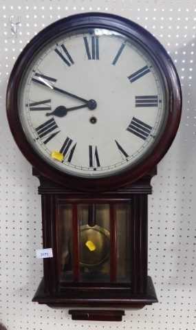 A mahogany cased wall clock, the circular enamel dial bearing Roman numerals, with a thirty hour...