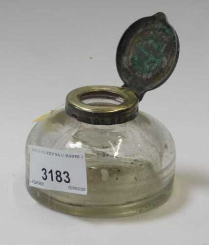 An early 20thC glass inkwell, with metal mount.
