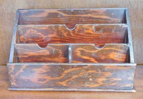 A stained pine desk top letter rack, 33cm wide.