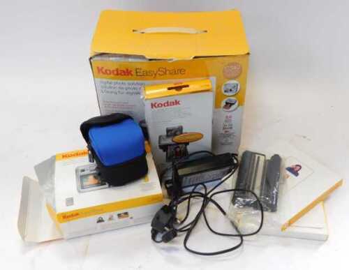 A Kodak Easy Share printer, together with paper, a C340 camera, charging cables, etc. (boxed)