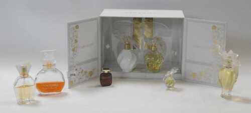 A Nina Ricci L'air Du Temps two bottle perfume set, with contents, together with further perfume,...