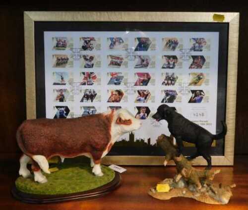 A Leonardo resin model of a bull, together with a Sherratt & Simpson Labrador standing on trunk...