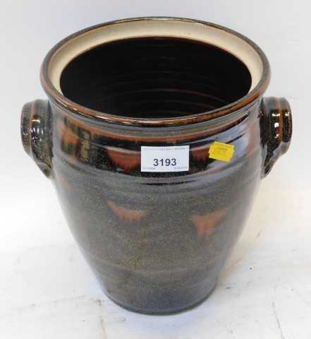 A Chris Ashton Elkesley Notts studio pottery twin handled vessel, of cylindrical tapering form,...