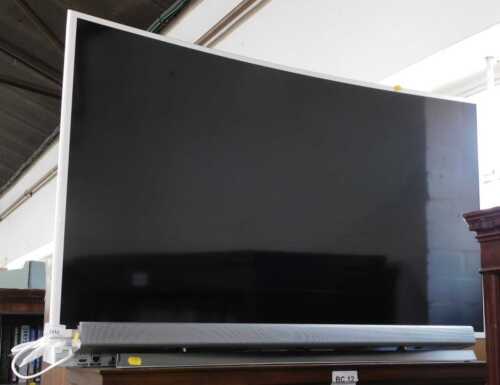 A Samsung 47" curved screen television, with lead, together with a Samsung soundbar, HW-J551/XU,...