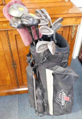 A Callaway Bertha golf bag, containing various golf clubs.