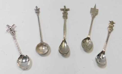 A group of white metal spoons, to include three Dutch examples, each terminal decorated with a...