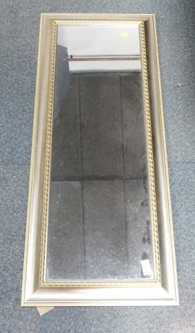 A gilt framed rectangular mirror.