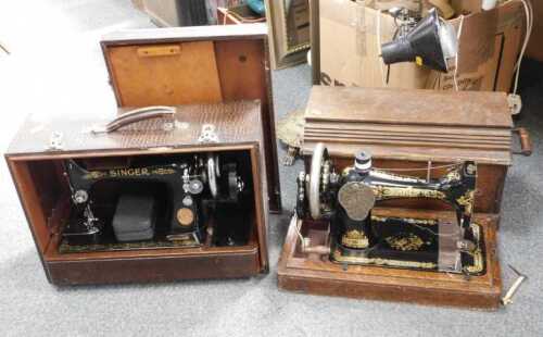 Two sewing machines, one electric, one hand crank. (contents under 1 table)