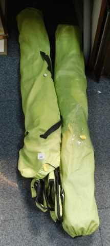 Two folding garden chairs, in bags. (contents under 1 table)