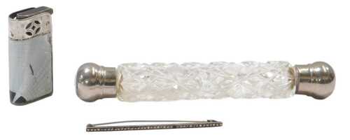 A Victorian cut glass double ended scent bottle, with metal ends, together with a white metal...