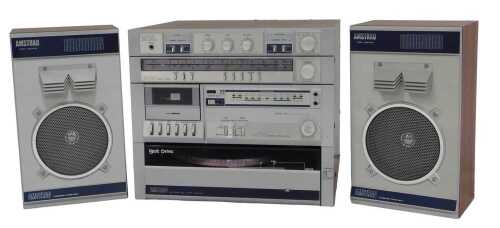 An Amstrad music system, comprising a stereo amplifier, stereo tuner, and an electronic...