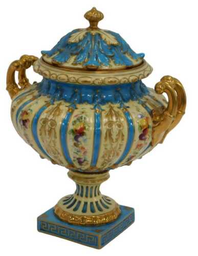 A Straus and Sohne Rudolstadt porcelain twin handled vase and cover, decorated with fruit and...