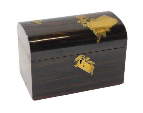 A Victorian coromandel tea caddy, of plain dome chest shaped design, the hinged lid with...