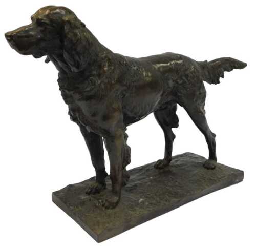 A bronzed resin figure modelled as a setter, raised on a rectangular naturalistic base, 36cm high.