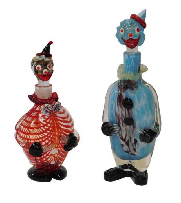 Two glass clown decanters, one in predominantly blue mottled and black glass, 40cm high, the...