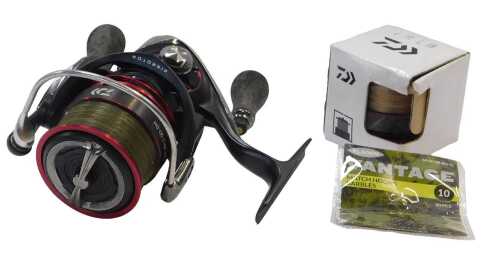 A Daiwa TDM3012QD-DH fixed spool reel, with a spare spool, boxed.
