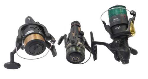 A Daiwa Auto 1657DM fixed-spool reel, a Fladen Chieften 60 fixed-spool reel, and an Okuma Dyna...