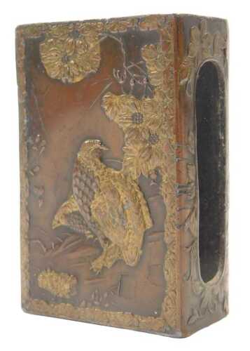 A Japanese Meiji period bronze match case, decorated with birds amongst foliage, within a leaf...