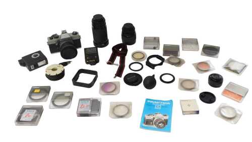 Cameras and optical related equipment, comprising a Praktica MTL 50 camera, various flashes, a...