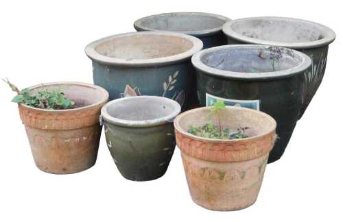 A group of garden plant pots, to include a pair of terracotta examples, 22cm high, green glaze,...