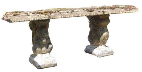 A concrete garden bench, the rectangular top raised on squirrel supports, 112cm wide.
