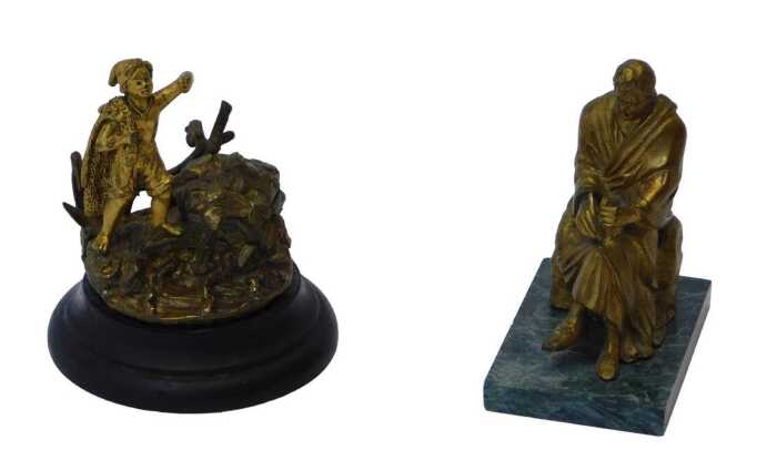 A 19thC gilt metal inkwell, in the form of a fisher boy with nets over his shoulder, on the...