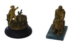 A 19thC gilt metal inkwell, in the form of a fisher boy with nets over his shoulder, on the...