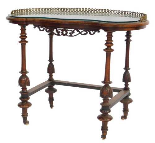 A Victorian walnut and inlaid kidney shaped occasional table, with a brass galleried back, and...