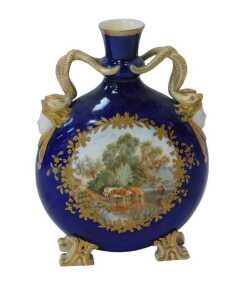 A 19thC Coalport style porcelain moon flask vase, with serpentine handles and mask heads, and a...